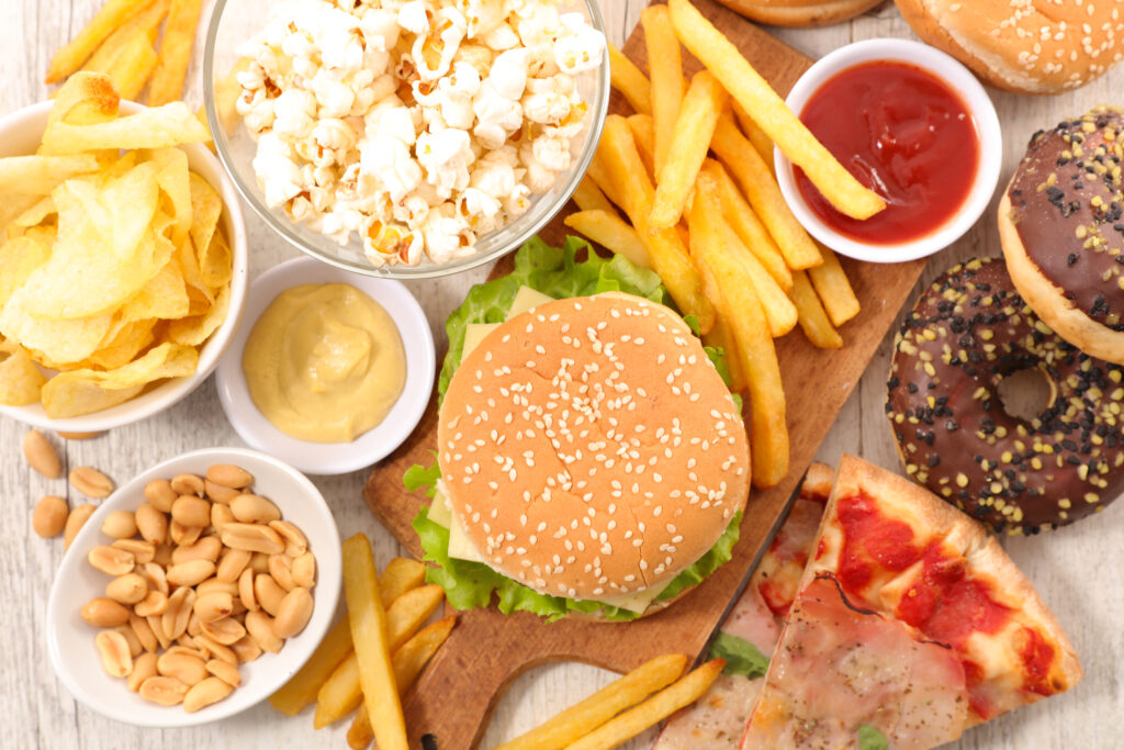 a picture of a bunch of junk food like burgers, fries, and pizza