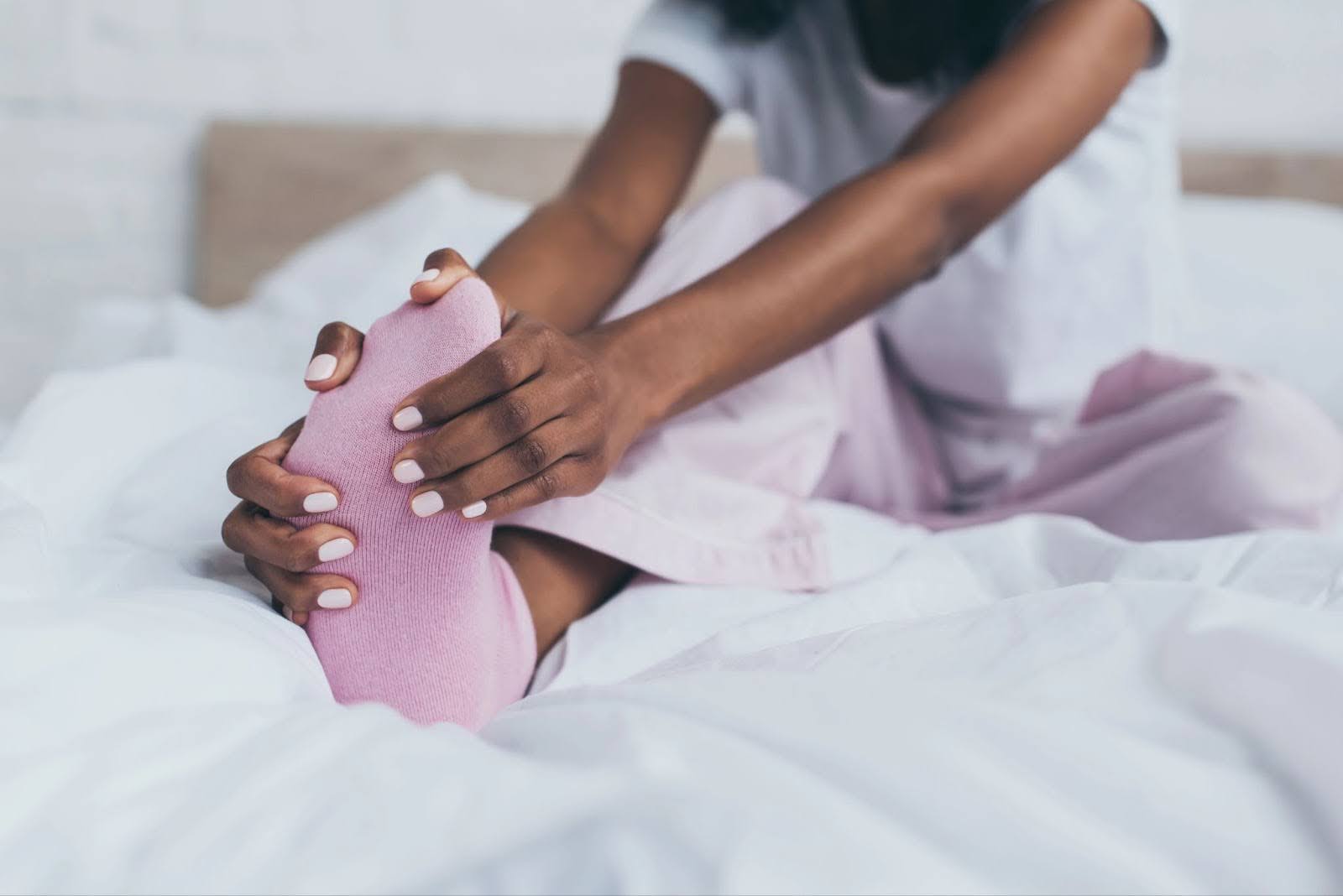 Woman stretching foot pain